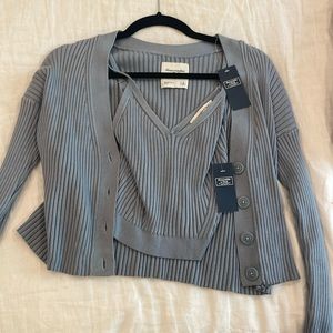 2 piece set: cami and sweater that are detachable. Never worn!